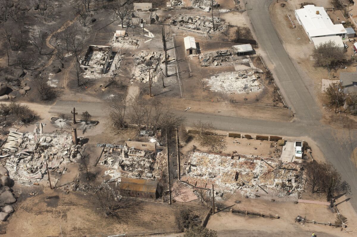 A charred landscape remains after a wildfire swept through the area in Yarnell, Ariz. Nineteen firefighters of the Granite Mountain Hotshots crew died June 30 as they battled the fast-moving blaze.