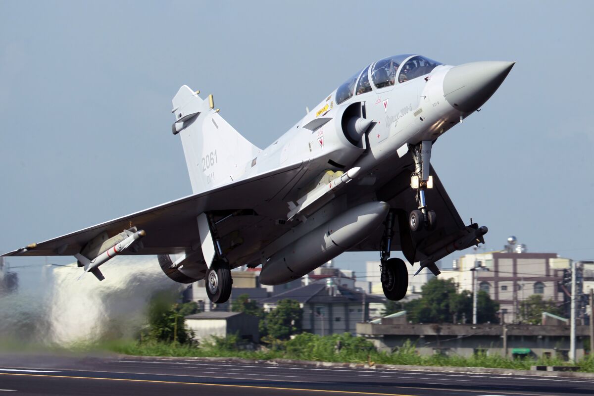 FILE - A Taiwan Air Force Mirage 2000 fighter jet takes off from a closed section of highway during the annual Han Kuang military exercises, Tuesday, Sept. 16, 2014, in Chiayi, central Taiwan. Taiwan’s air force said one of its French-made Mirage 2000 fighter jets appears to have been lost off the island’s east coast, but the pilot has been rescued after parachuting to safety. (AP Photo/Wally Santana, File)