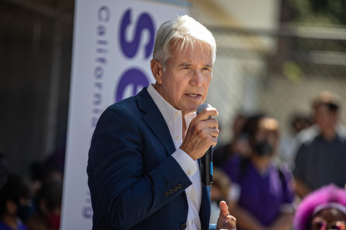 Los Angeles County Dist. Atty. George Gascón speaks into a microphone.