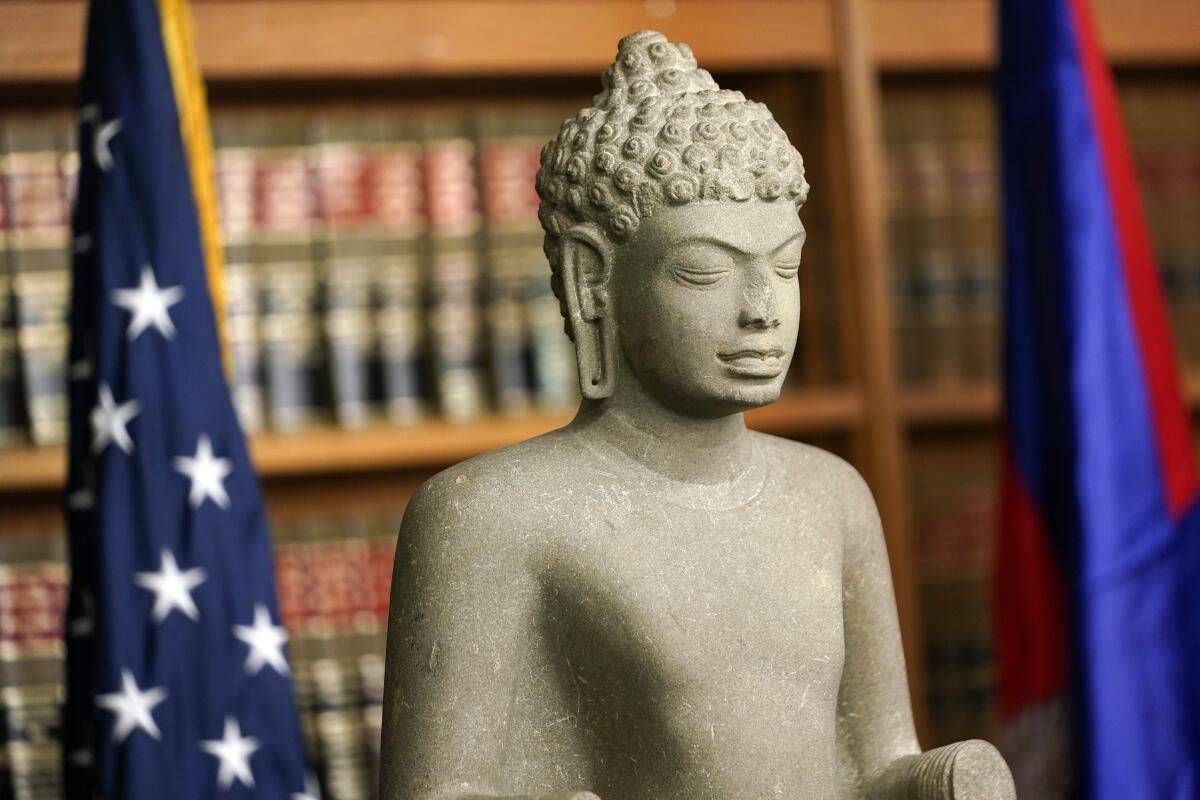Some of the Cambodian antiquities recovered by the United States Attorney's Office are displayed during a news conference in New York, Monday, Aug. 8, 2022. Officials were announcing the repatriation of 30 antiquities to Cambodia that had been illegally trafficked. (AP Photo/Seth Wenig)