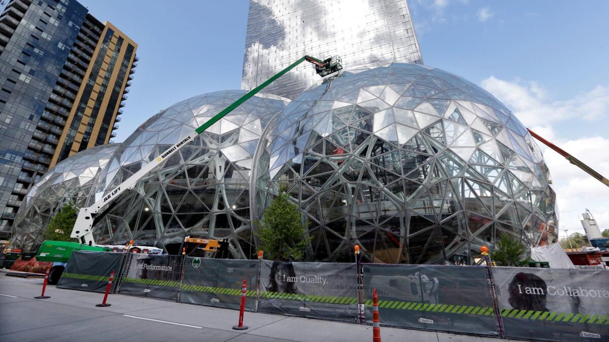 Three large, glass-covered domes were under construction in April at the Amazon.com campus in Seattle. Amazon plans to spend more than $5 billion to build a second headquarters in North America.