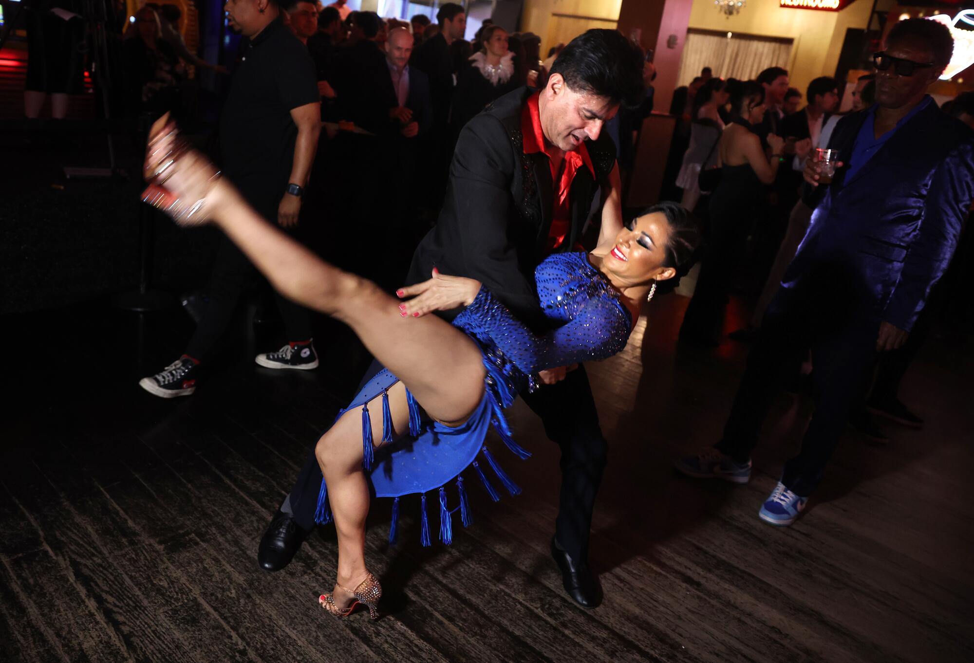Dancers enjoy themselves at the Conga Room during a farewell show after 25 years in business.