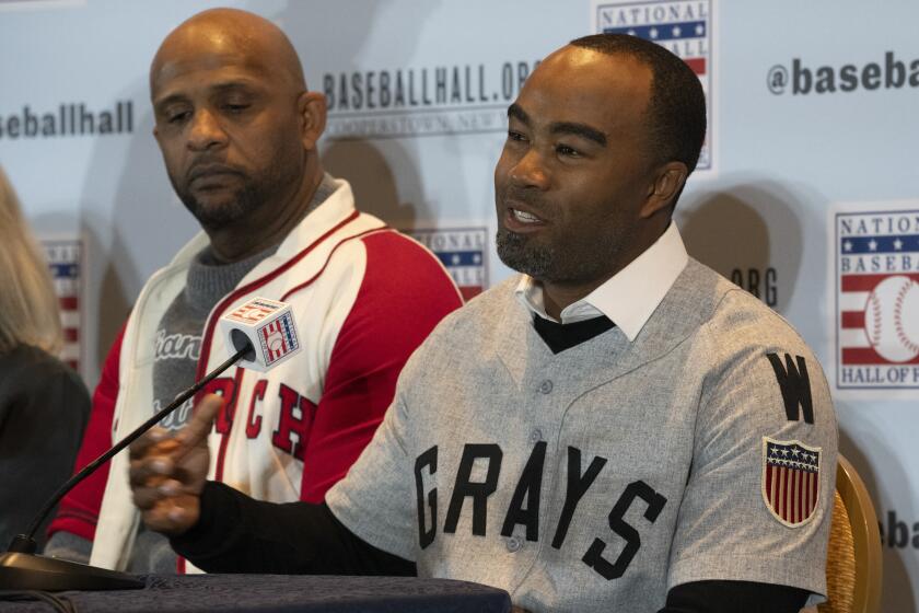 Josh Barfield, right, and CC Sabathia, left, respond to questions during news conference at the Major League Baseball winter meetings Tuesday, Dec. 5, 2023, in Nashville, Tenn. The two intend to play in the May 25 Hall of Fame East-West Classic. The game will be played in conjunction with the opening of the Hall's "Souls of the Game: Voices of Black Baseball" exhibit. (AP Photo/George Walker IV)