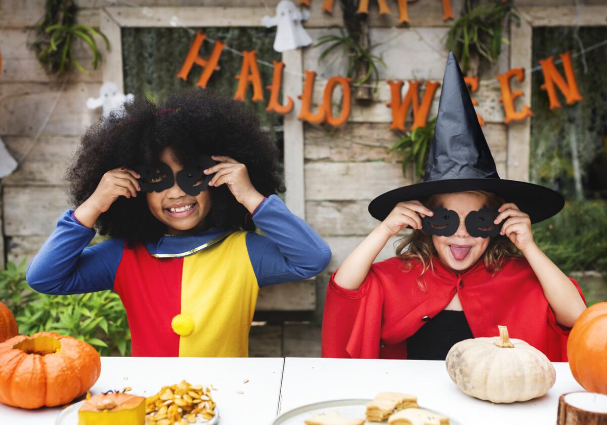 Kids in costume enjoying the Halloween season.