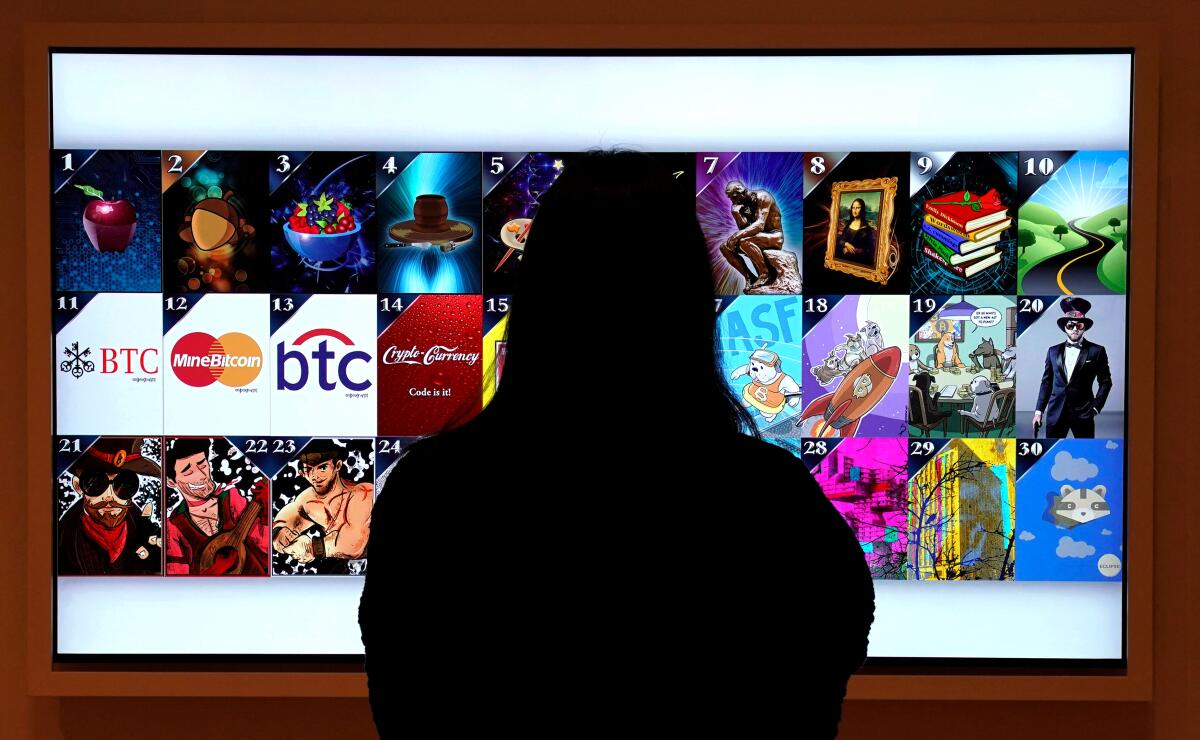 The silhouette of a woman looking at a screen with 30 digital images