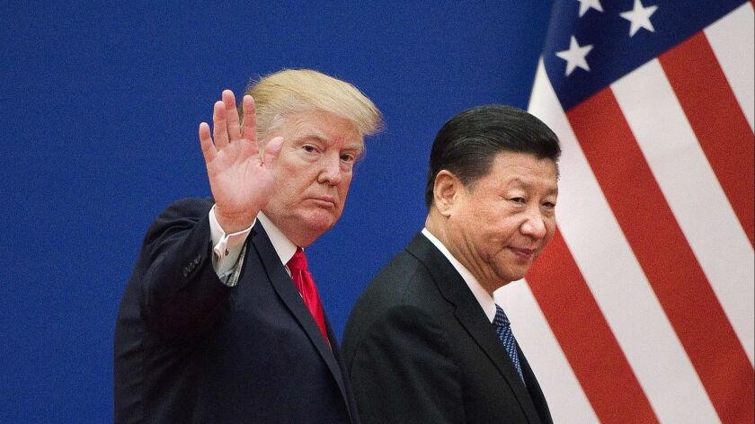 President Trump and Chinese counterpart Xi Jinping leave a business leaders event at Beijing's Great Hall of the People on Nov. 9, 2017.