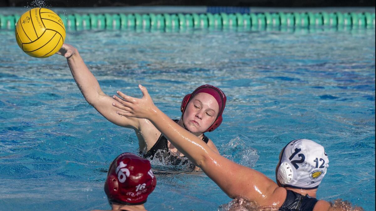 Laguna Beach's Rachael Carver, shown taking a shot in a Dec. 28, 2018 match against Newport Harbor, helped the Breakers to a 13-6 win over Corona del Mar on Thursday.