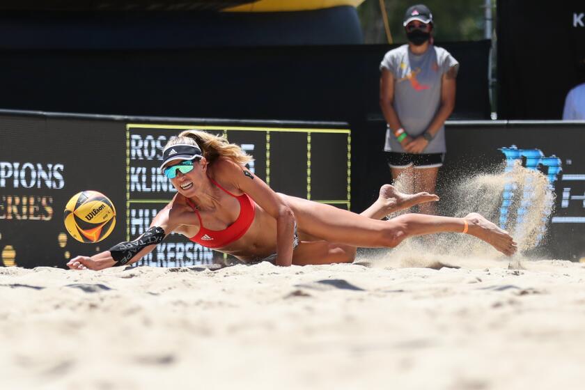 SUNDAY, JULY 19, 2020: Alix Klineman dives to make a dig during Sunday's AVP tournament in Long Beach.