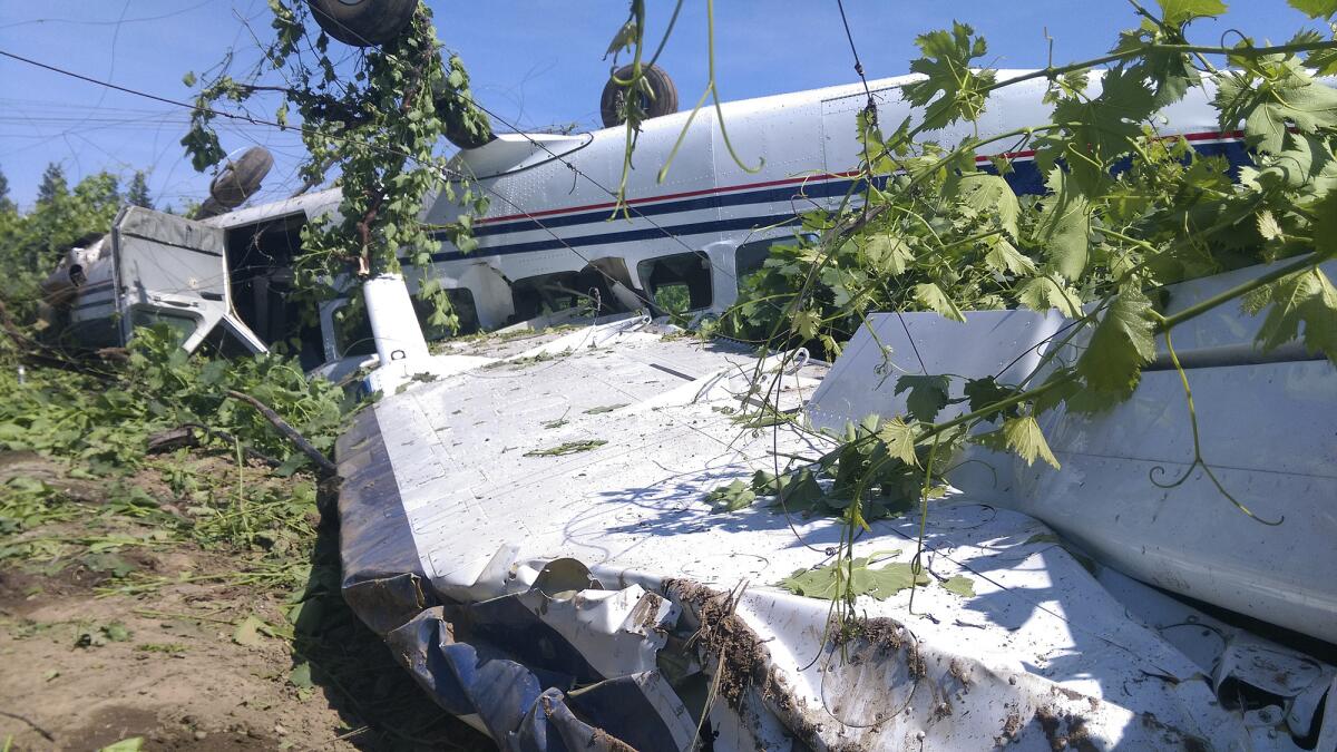 A single-engine Cessna sits flipped over after crashing in a vineyard in rural San Joaquin County near Lodi.