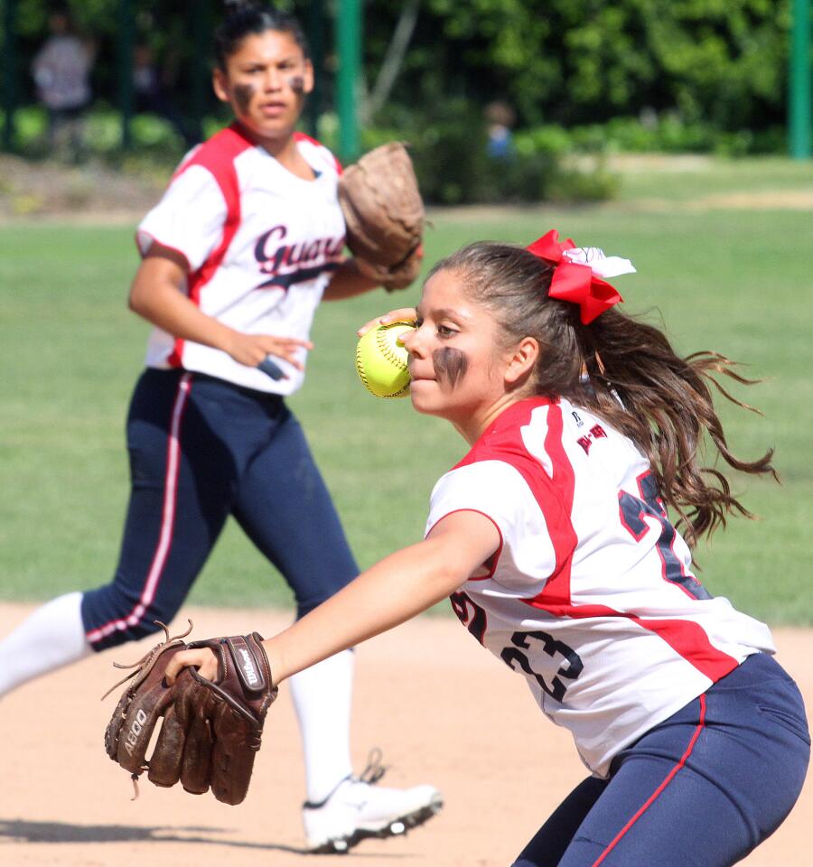 Bell-Jeff's second baseman Jessica Pereyra makes a play in the first inning against Chaminade in a softball game at Robert Gross Park in Burbank on Friday, March 21, 2014. (Tim Berger/Staff Photographer)