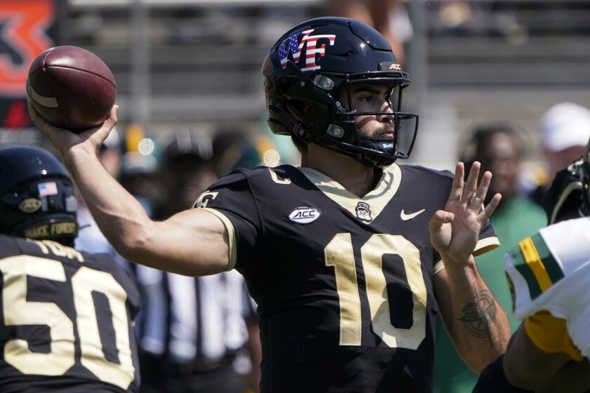 Wake Forest quarterback Sam Hartman passes against the Norfolk State during the first half of a NCAA college football game Saturday, Sept. 11, 2021, in Winston-Salem, N.C. (AP Photo/Chris Carlson)