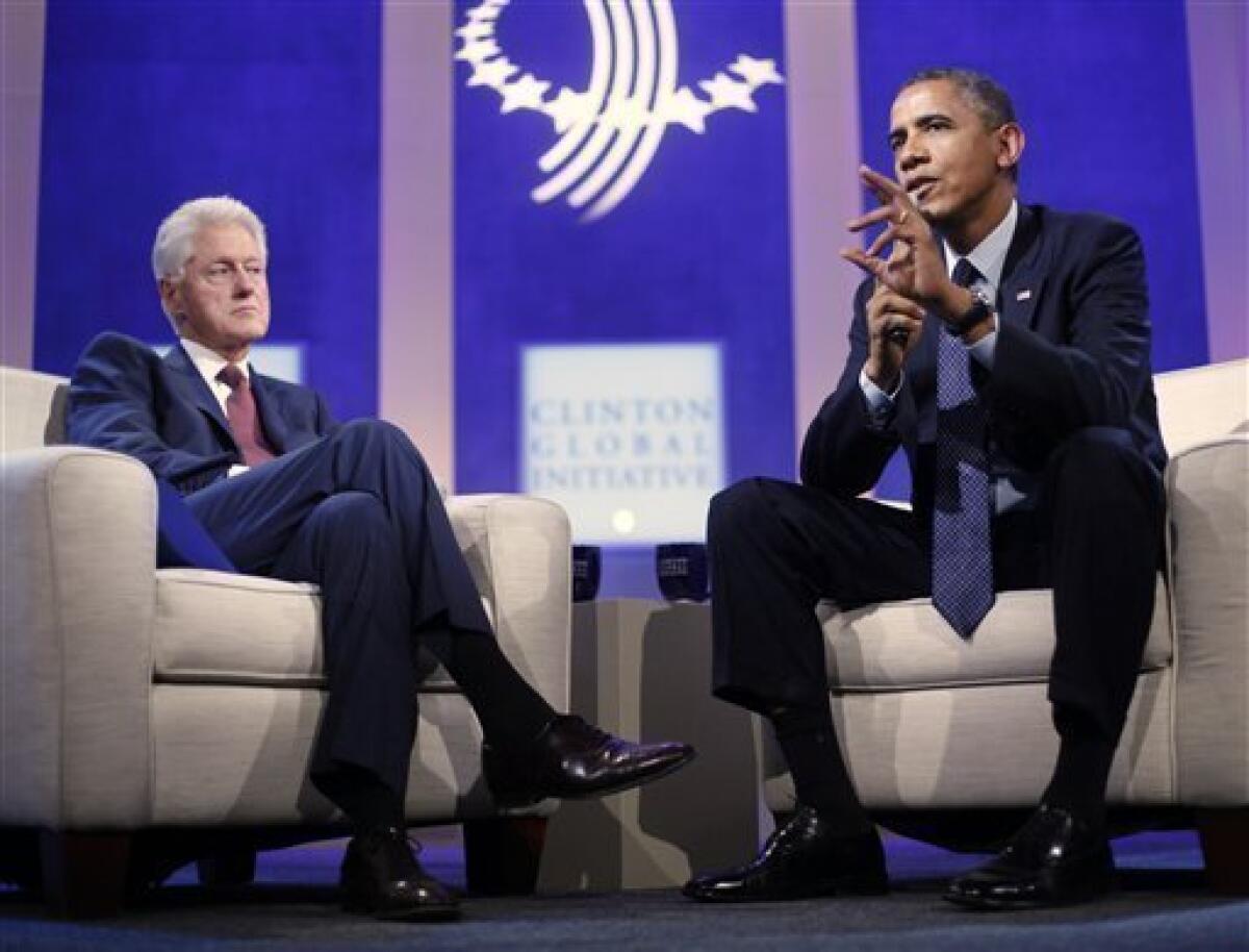 President Obama with former President Bill Clinton at the Clinton Global Initiative in New York.