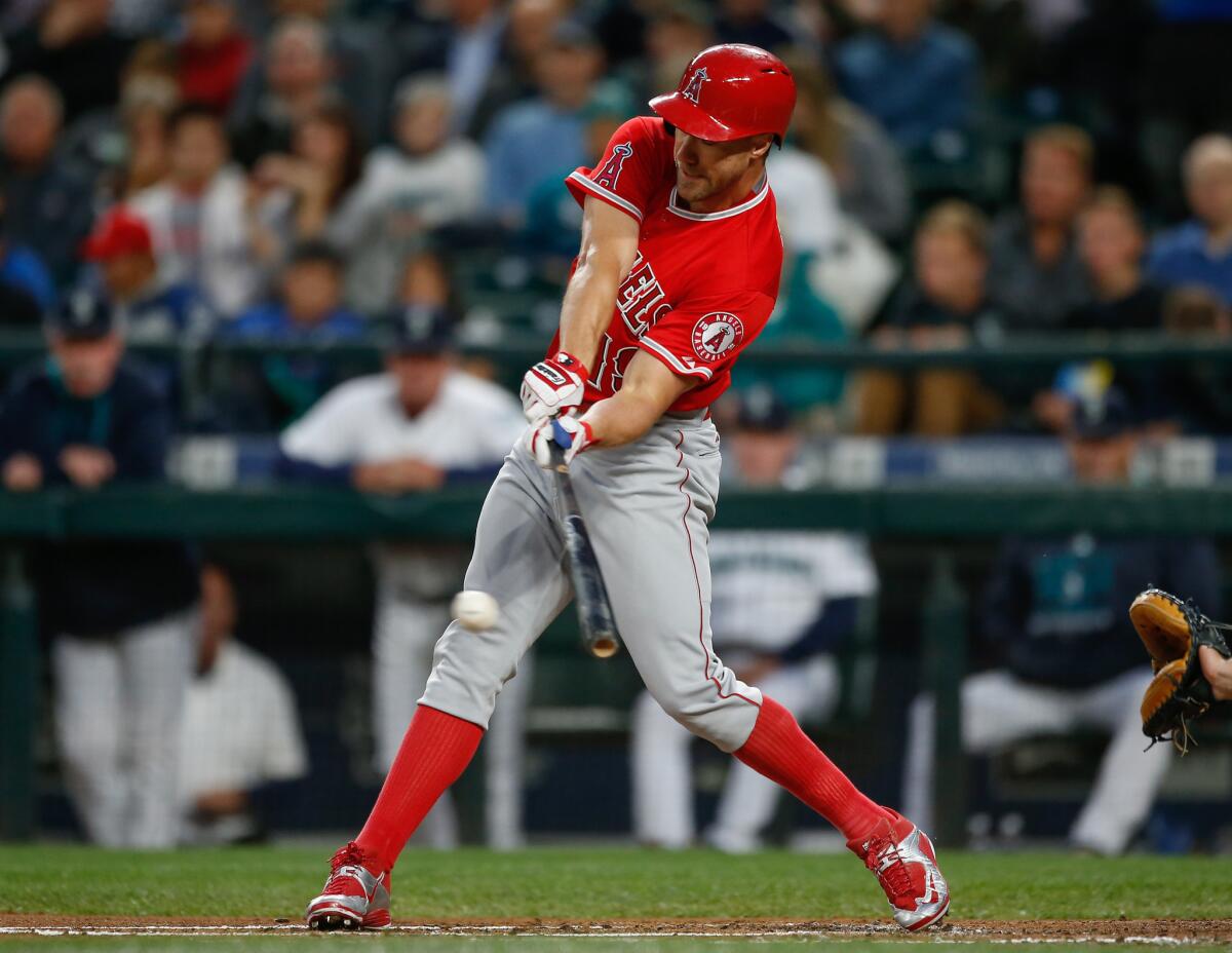 Angels left fielder David Murphy hits a single during the second inning of a game against the Mariners in Seattle on Sept. 14.
