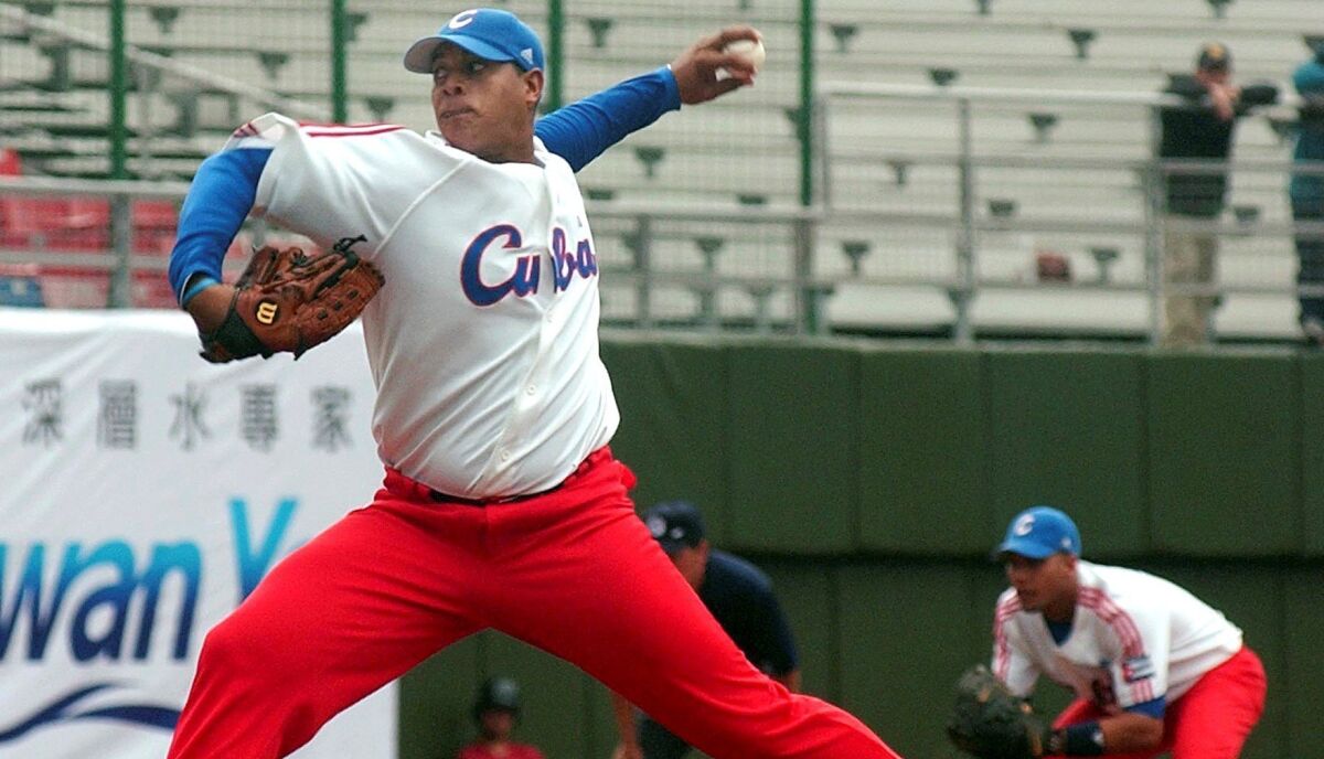 Cuba's pitcher Elier Sanchez Quesada pitches against Australia in the first inning of their first game of the 37th Baseball World Cup, Wednesday, Nov. 7, 2007, in Taipei, Taiwan. Cuba defeated Australia 3-2.