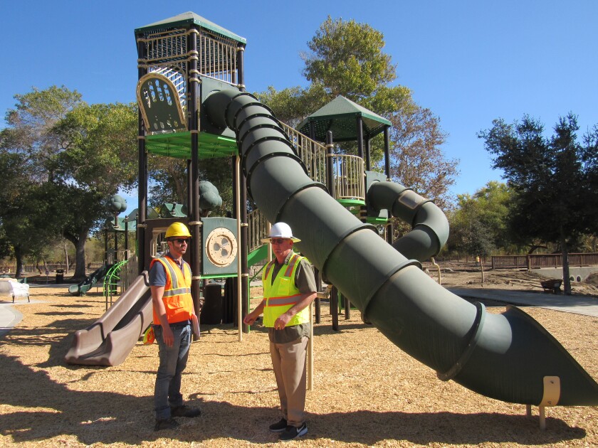 Emmanuel Padilla, project manager for the Mast Park renovation, talks to Santee Community Services Director Bill Maertz at one of the playground areas for kids. The park, closed since December 2018, is expected to re-open in January 2020.
