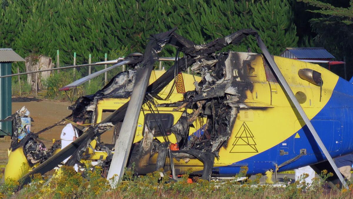 One of three helicopters that were burned in Curanilahue, Chile, lies in ruins on Wednesday.