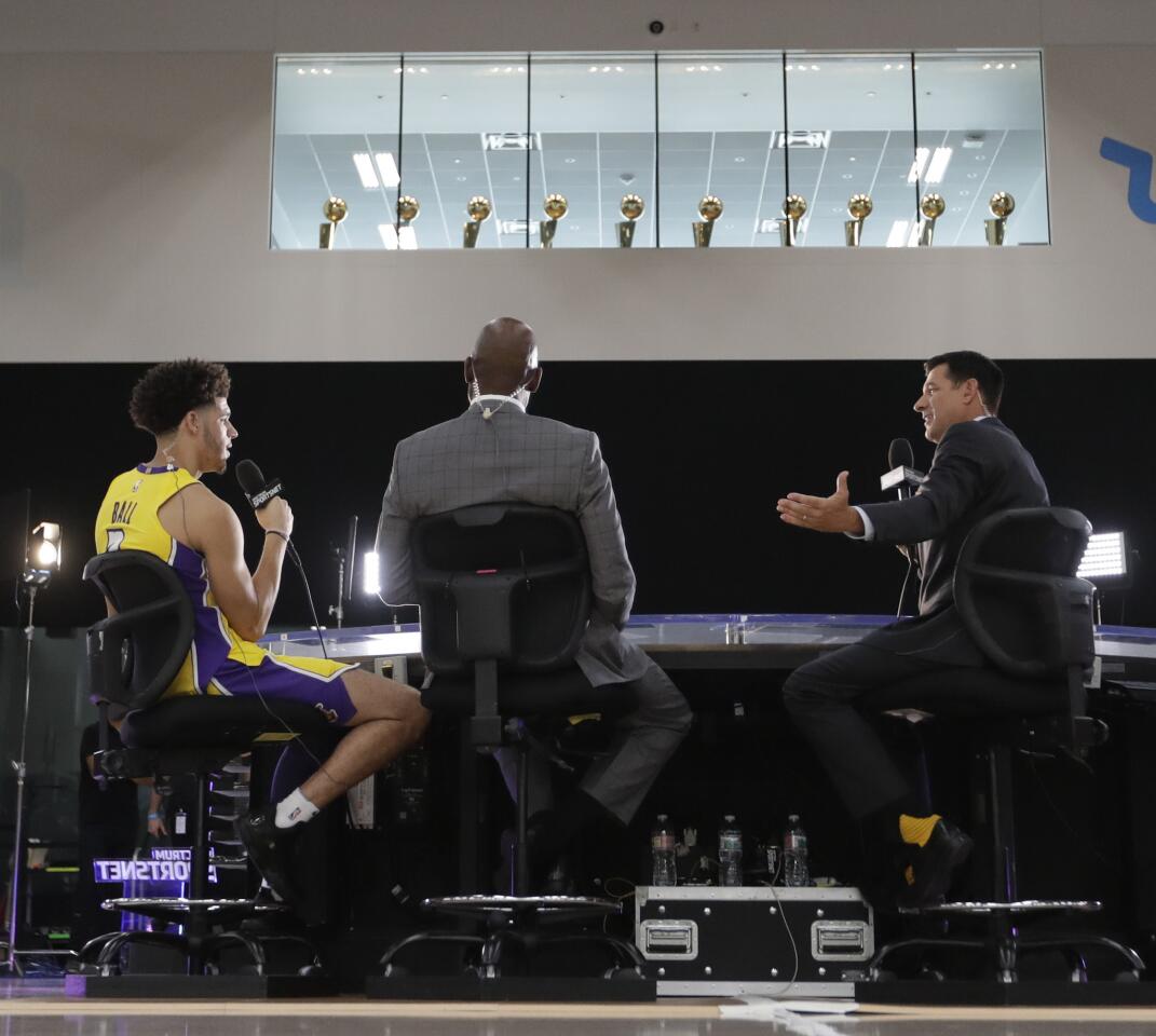 Los Angeles Lakers guard Lonzo Ball, left, talks during an interview during an NBA basketball media day at the UCLA Health Training Center in El Segundo, Calif., Monday, Sept. 25, 2017. (AP Photo/Chris Carlson)