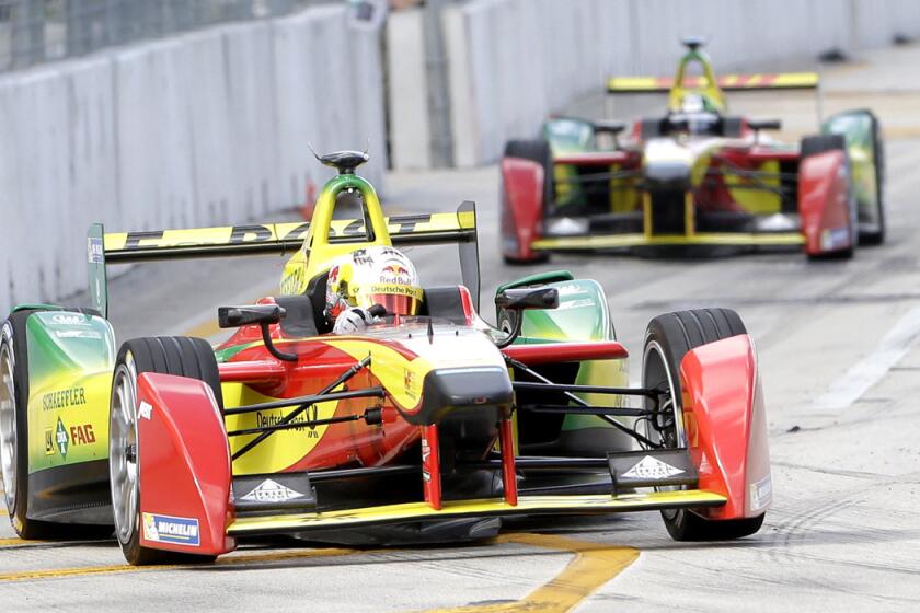 Daniel Abt, foreground, and Lucas di Grassi, rear, in the Audi Sport ABT team cars race during the Formula E Miami ePrix auto race in Miami on March 14.