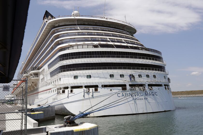 FILE - The Carnival cruise line ship Carnival Magic sits docked on April, 2020, in Cape Canaveral, Fla. The U.S. Coast Guard said Tuesday, May 30, 2023, that it's searching for a man who fell from a cruise ship off the coast of Florida. The 35-year-old was on the Carnival Magic when he fell from the ship about 186 miles east of Jacksonville, Fla., on Monday, May 29. (AP Photo/John Raoux, File)