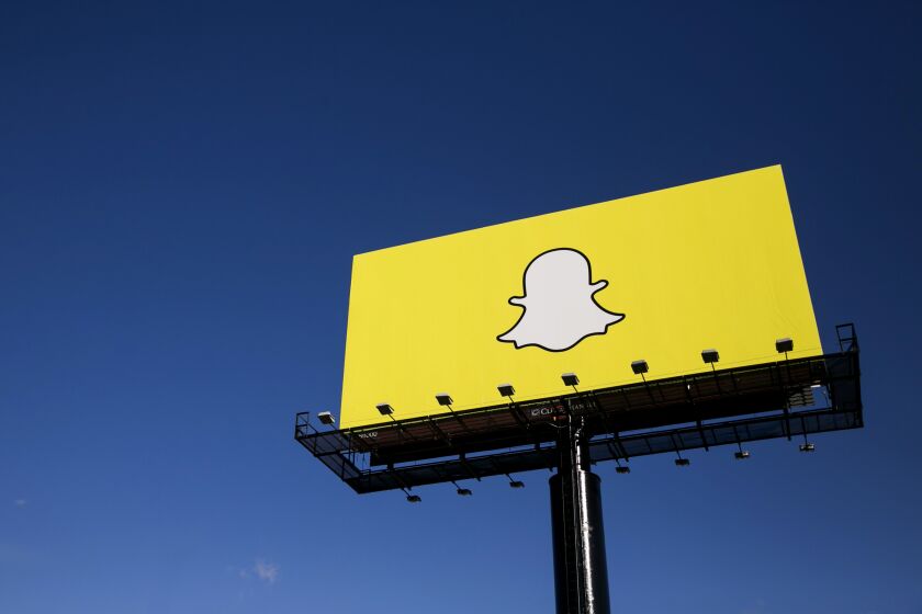 An advertising billboard featuring the Snapchat logo in Richfield, Minnesota on October 24, 2015. Photo by Kristoffer Tripplaar *** Please Use Credit from Credit Field ***
