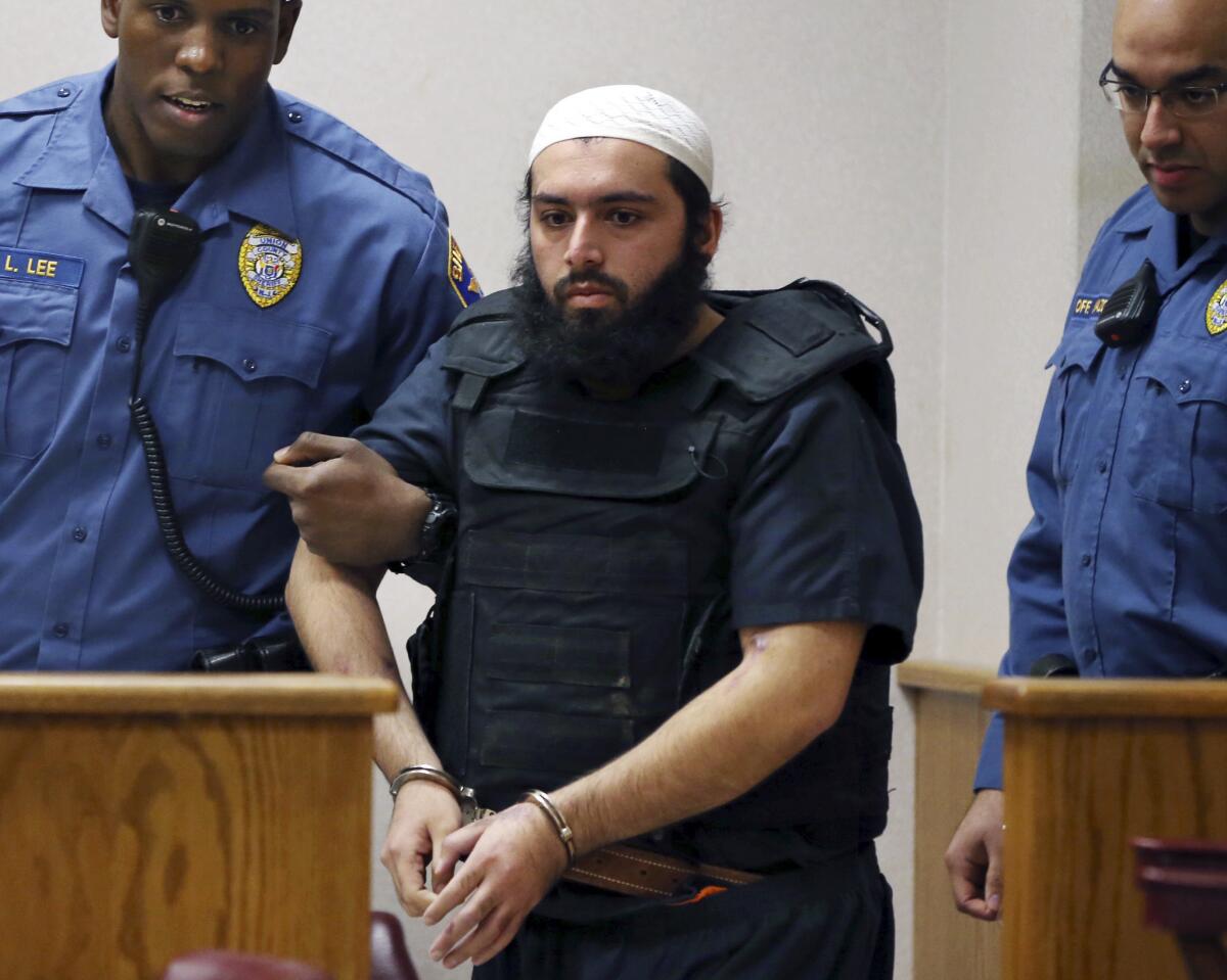 Ahmad Khan Rahimi, convicted of setting off bombs in New York, is led into court in Elizabeth, N.J., on Dec. 20, 2016.