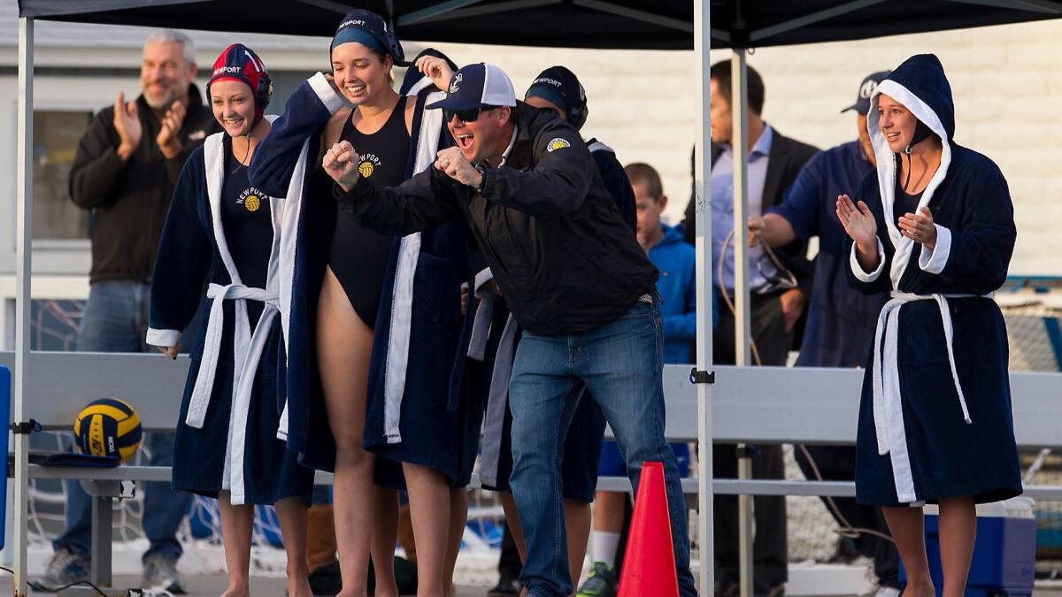 Brian Melstrom, center, shown coaching on Dec. 19, 2014, is retiring as coach of the Newport Harbor High girls' water polo team. He was 43-37 in three seasons.