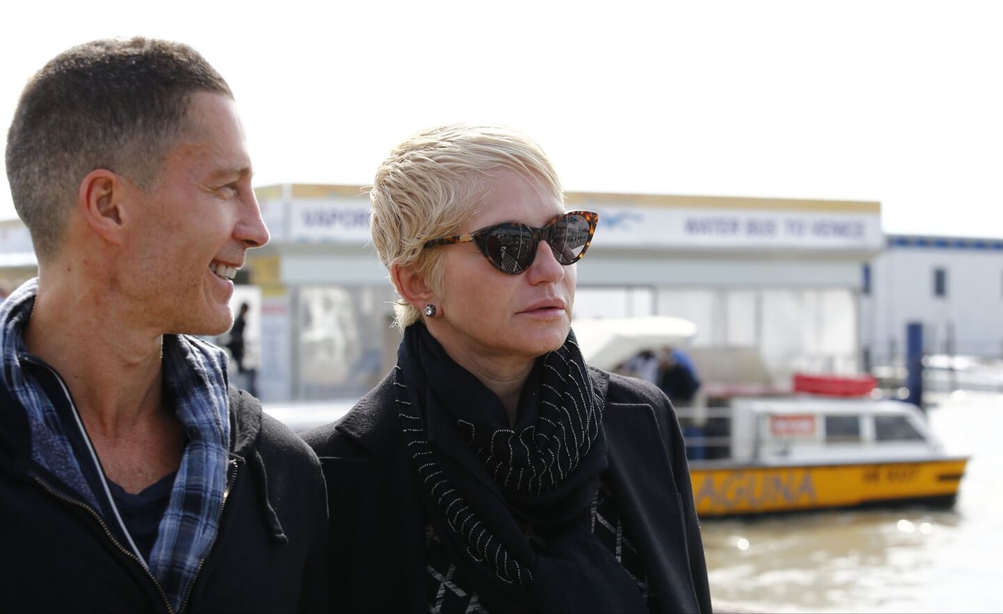 Ellen Barkin and an unidentified guest arrive at Marco Polo Airport in Venice. Barkin was in "Ocean's Thirteen" with George Clooney.