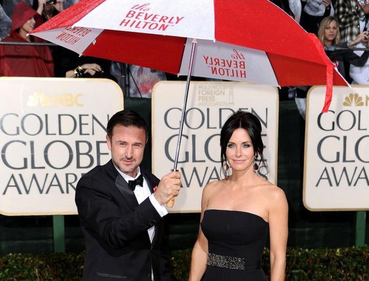 David Arquette and Courteney Cox, who finalized their divorce, arrive at the Golden Globe Awards together in 2010.