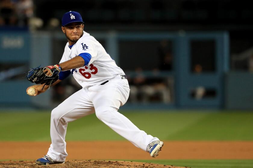 Dodgers' Yimi Garcia pitches in relief during the seventh inning against the San Francisco Giants at Dodger Stadium on April 16.