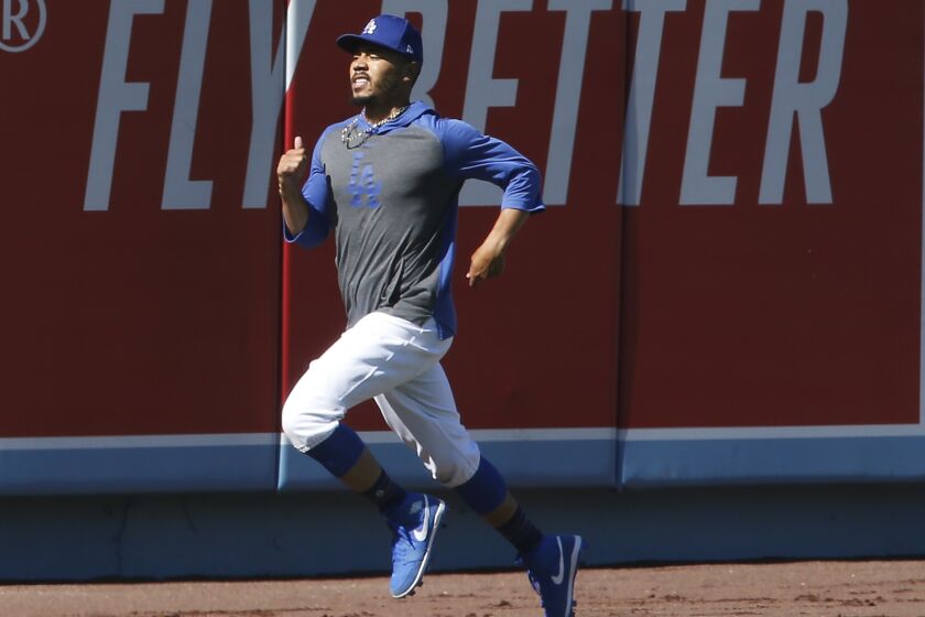 LOS ANGELES, CALIF. - JULY 3, 2020. Dodgers right fielder Mookie Betts joins in team drills during practice at Dodger Stadium on Friday, July 3, 2020. (Luis Sinco/Los Angeles Times)