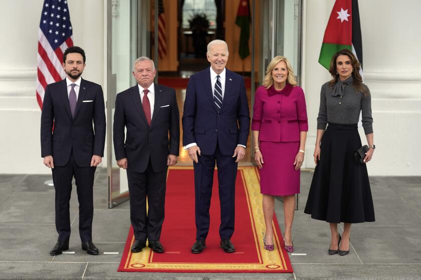 President Joe Biden, third left, and first lady Jill Biden, second right, greet Jordan's King Abdullah II, second left, Queen Rania, right, and Crown Prince Hussein, left, on the North Portico of the White House, Monday, Feb. 12, 2024, in Washington. (AP Photo/Evan Vucci)