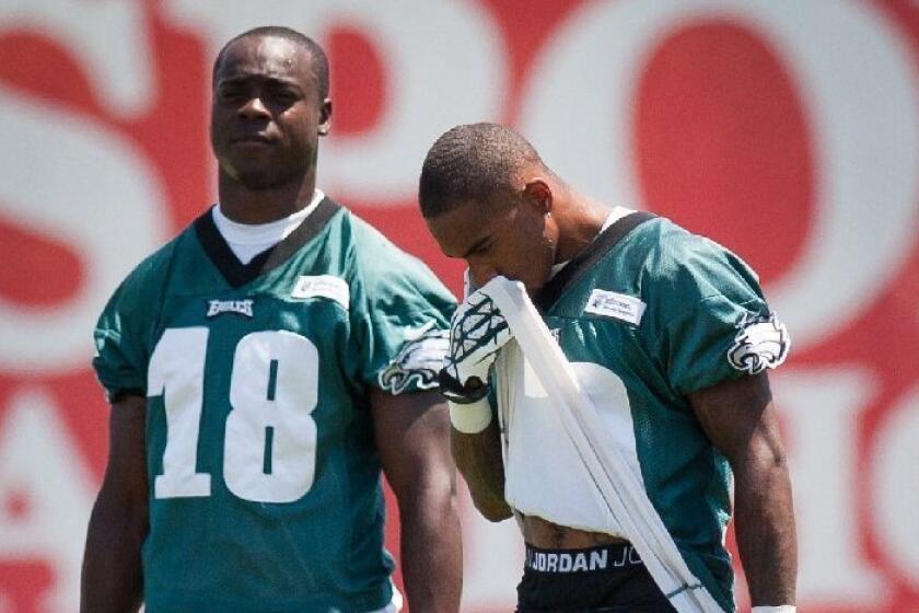 Philadelphia Eagles wide receivers Jeremy Maclin, left, takes a break with DeSean Jackson between drills on Friday. Maclin suffered an injury to his right knee at camp Saturday.