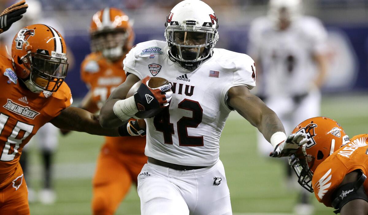 Northern Illinois running back Cameron Stingily (42) picks up 42 yards against Bowling Green in the second half Friday night.