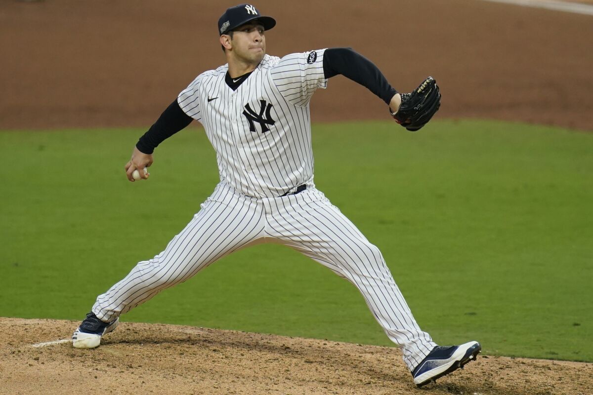 New York Yankees relief pitcher Luis Cessa throws against the Tampa Bay Rays during the sixth inning in Game 3 of a baseball American League Division Series, Wednesday, Oct. 7, 2020, in San Diego. (AP Photo/Gregory Bull)