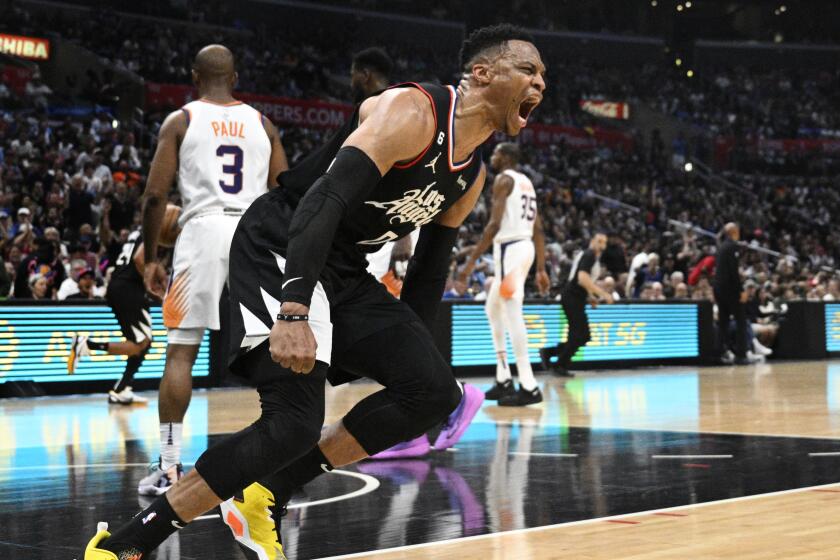 LOS ANGELES, CA -APRIL 22, 2023: LA Clippers guard Russell Westbrook (0) reacts after a breakaway slam dunk against the Phoenix Suns in Game 4 of the first round NBA playoffs at Crypto.com Arena on April 22, 2023 in Los Angeles, California. His game high 37 points weren't enough in the 100-112 loss to the Suns.(Gina Ferazzi / Los Angeles Times)