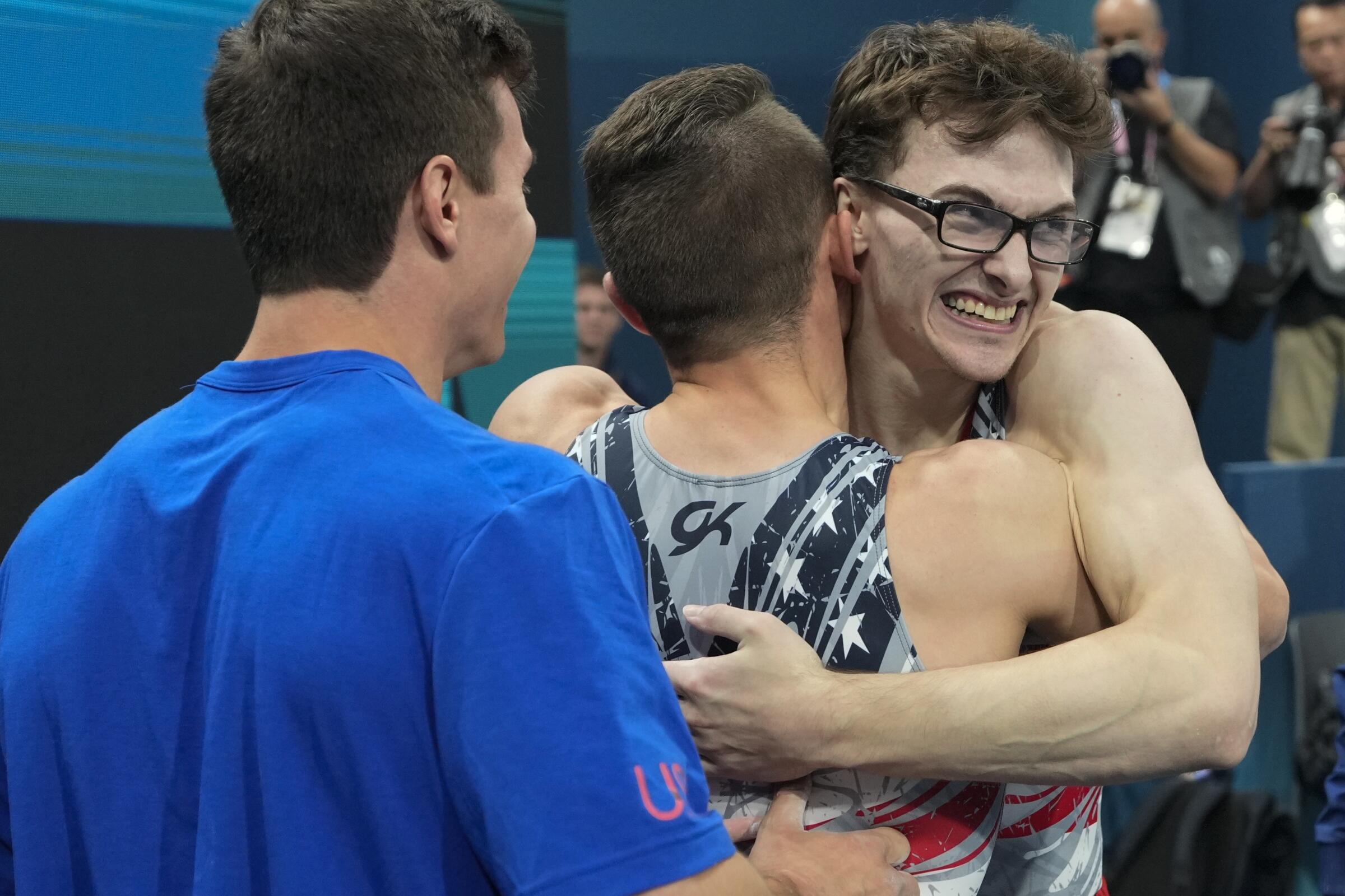 Stephen Nedoroscik of the U.S. gets a hug from Paul Juda after he completed his pommel horse routine 