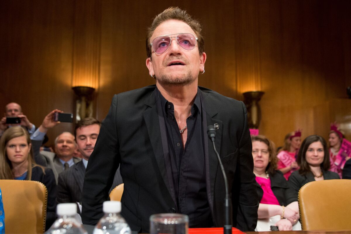 Singer Bono of U2 prepares to testify before a Senate subcommittee about extremists and foreign assistance.