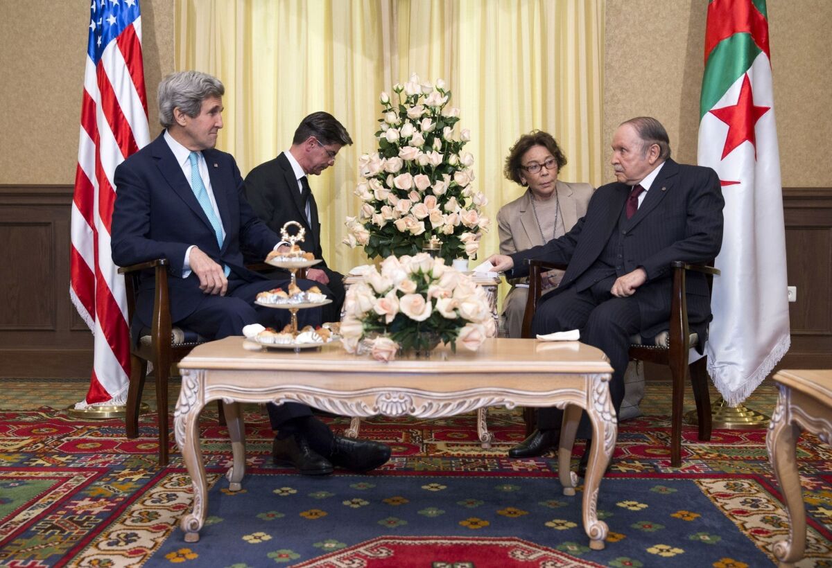Secretary of State John F. Kerry, left, meets with Algerian President Abdelaziz Bouteflika, right, through translators, in Algiers, the capital.