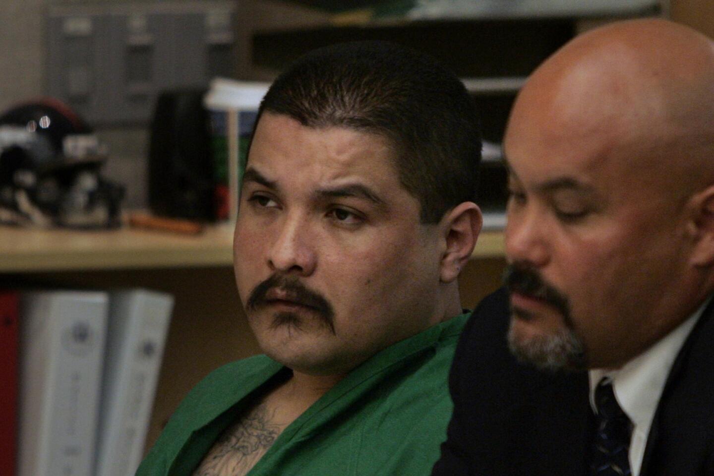 February 7, 2006 file photo of Adrian Camacho, left, with lawyer William Stone, as they listen to Judge Joan Weber read the death sentence in a Vista courtroom. Camacho, 43, shot and killed Oceanside police Officer Tony Zeppetella during a traffic stop in June 2003.