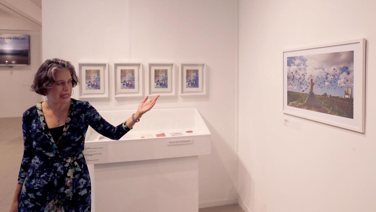 Curator Alessandra Moctezuma gives a tour of "unDocumenta" at the Oceanside Museum of Art.