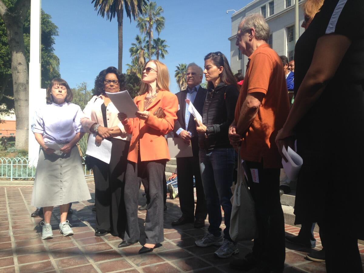 Members of the Coalition to Preserve L.A., appearing outside City Hall, said Tuesday they had changed their strategy for winning passage of their planned Neighborhood Integrity Initiative -- rewriting the measure and shifting their focus to the March 2017 election.