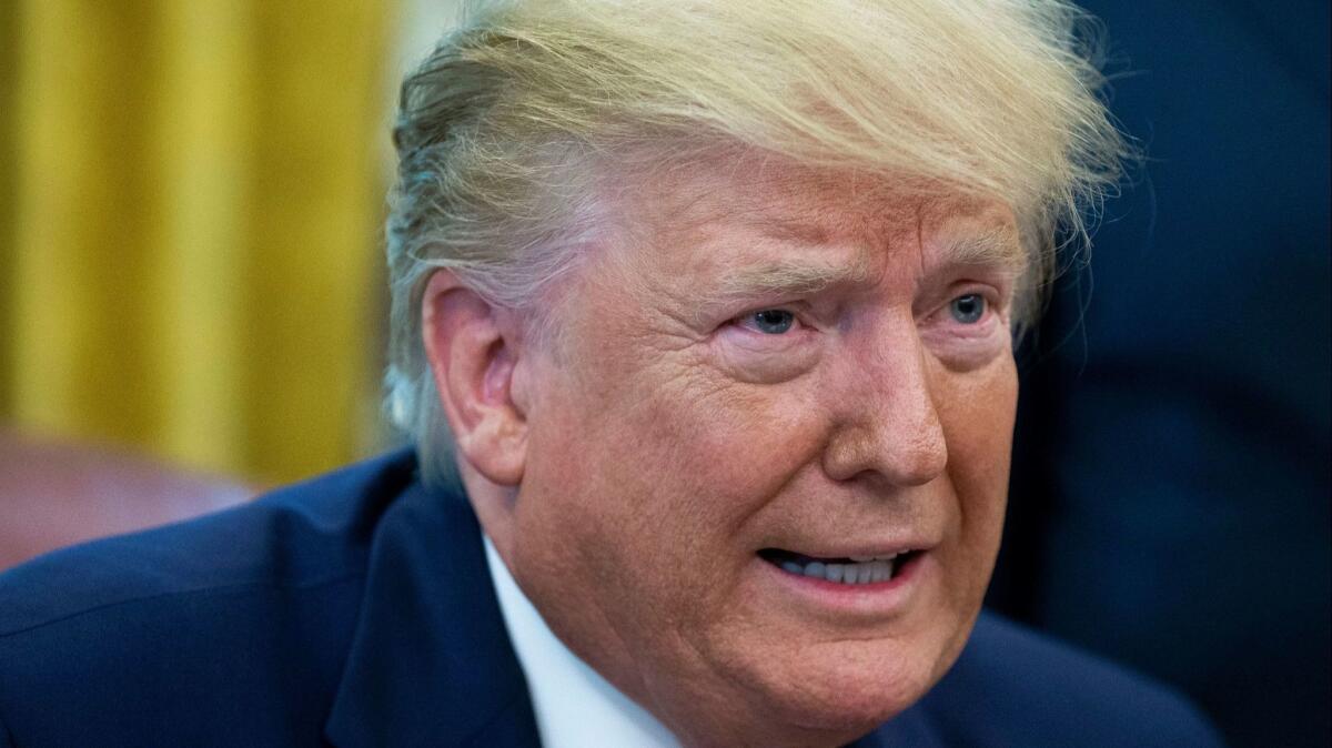 President Trump speaks to reporters in the Oval Office on Monday.