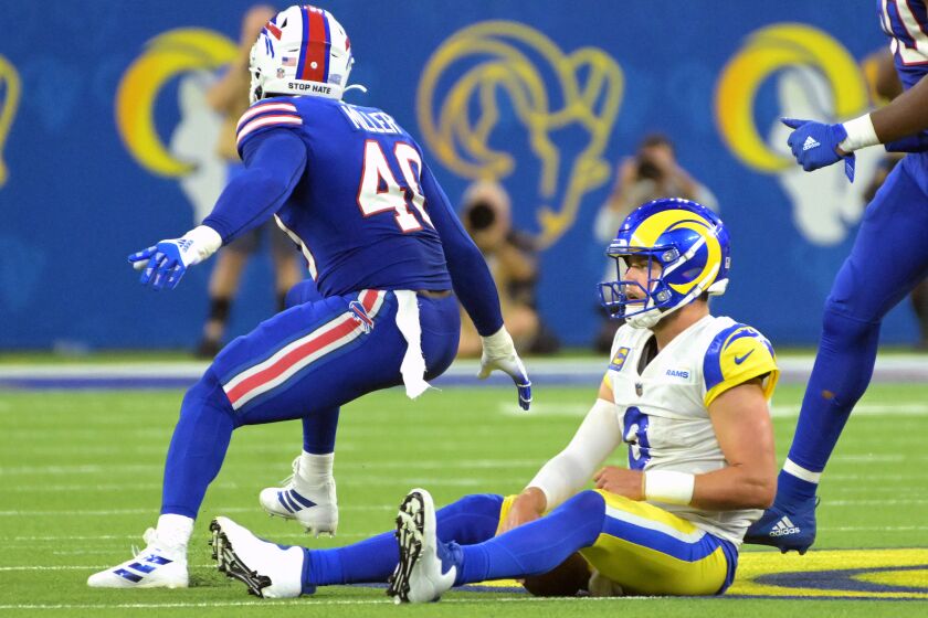 Inglewood, California September 8, 2022-Rams quarterback Matthew Stafford can only watch as Bills Von Miller celebrates a sack in the third quarter at SoFi Stadium Thursday. (Wally Skalij/Los Angeles Times)