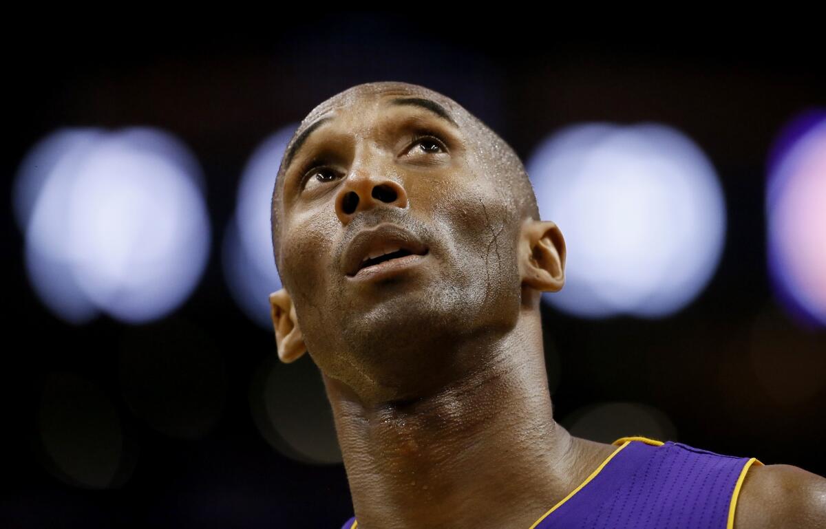Kobe Bryant, looking at the scoreboard during the second half of the Lakers' 119-99 loss to the Phoenix Suns on Oct. 29, can't like what he sees.