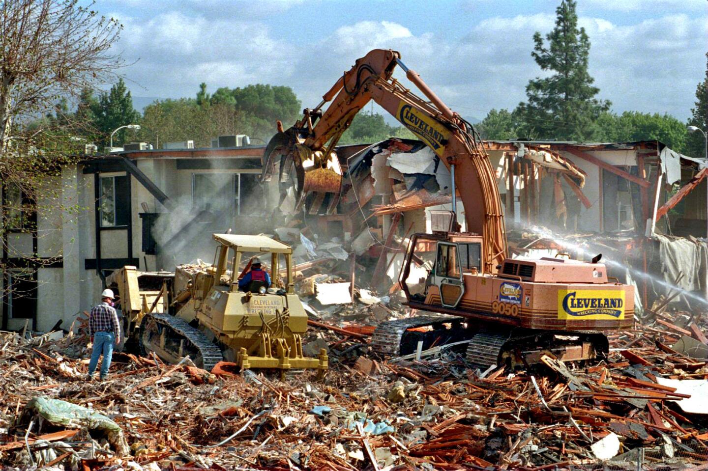 A demolition crew begins work on the Northridge Meadows apartment complex.