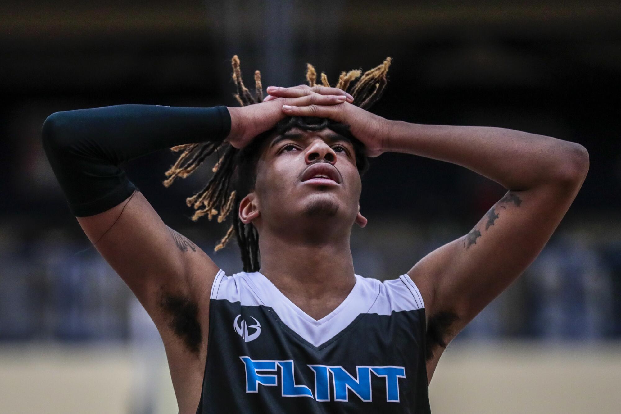 Flint's Taevion Rushing shows his frustration during the team's season opener against Bendle High.