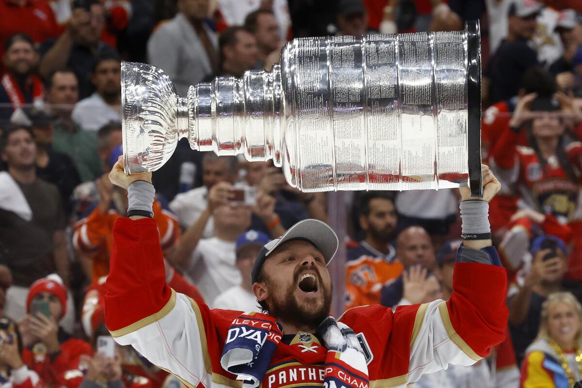 Florida Panthers forward Sam Reinhart celebrates with the Stanley Cup after a 2-1 win over the Edmonton Oilers.