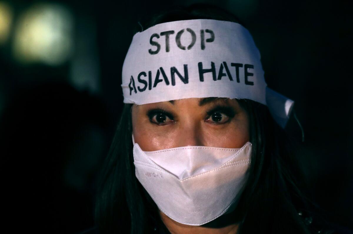 Locals like Irvine resident Vanessa Nguyen came out to a 2021 candlelight vigil in Garden Grove to stop Asian hate.