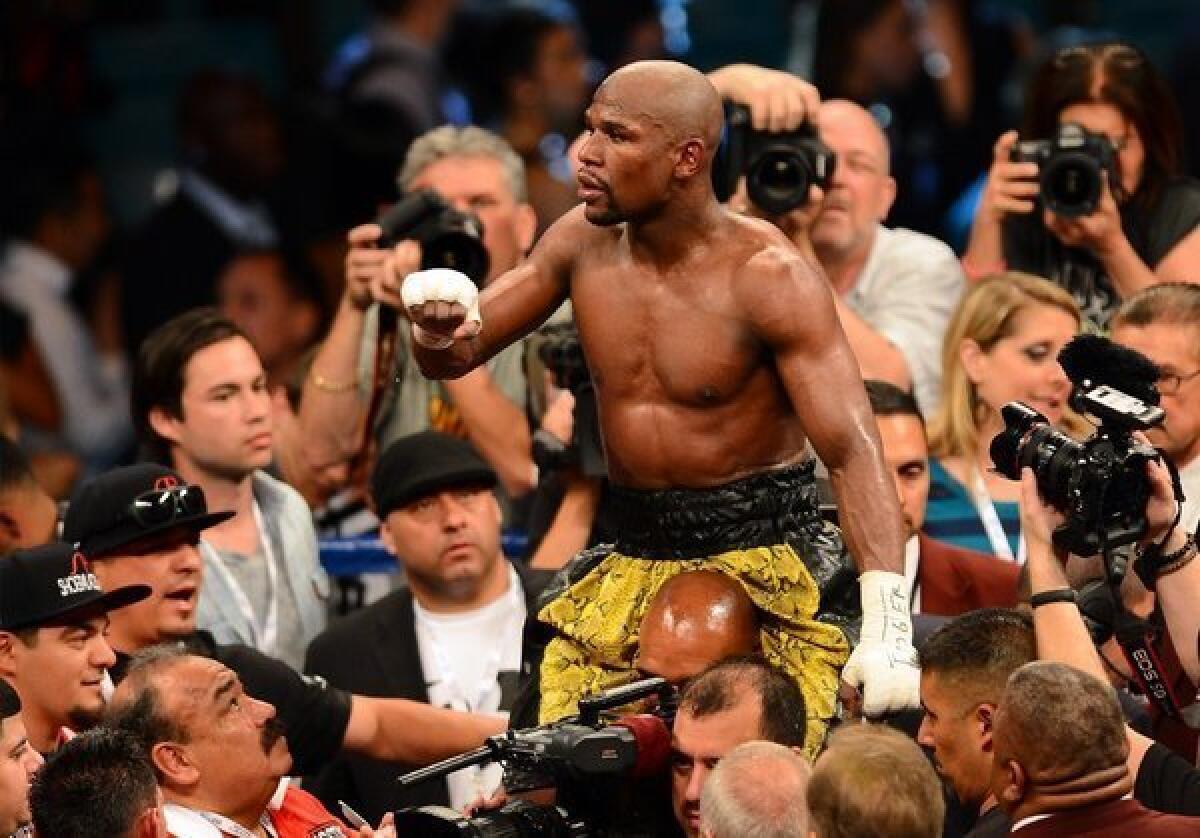 Floyd Mayweather Jr. celebrates his unanimous decision victory against Robert Guerrero in their WBC welterweight title bout at the MGM Grand Garden Arena on May 4.