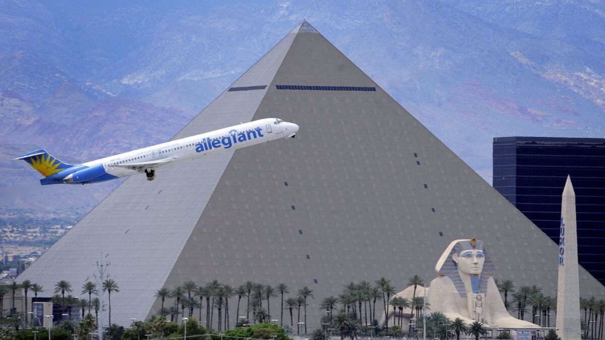 An Allegiant Air jet flies takes off from McCarran International Airport in Las Vegas in 2013. Pilots for the airline have agreed to strike if a dispute over scheduling is not fixed soon.